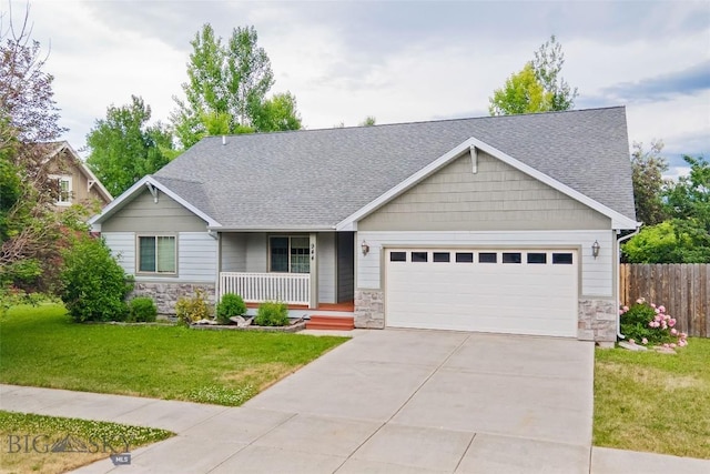 944 Forest Glen Dr, Bozeman, MT 59718 - craftsman-style home featuring stone siding, covered porch, and an attached garage