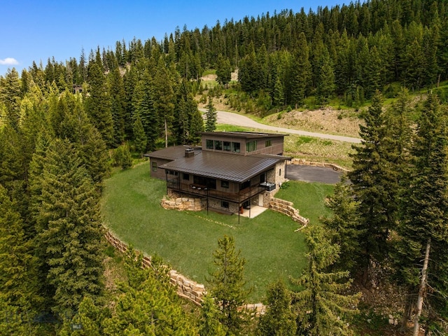 544 Grey Drake, Big Sky, MT 59716 - view of subject property with a heavily wooded area