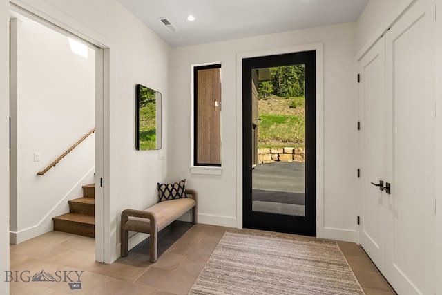 544 Grey Drake, Big Sky, MT 59716 - entryway featuring light tile patterned flooring, stairway, and recessed lighting