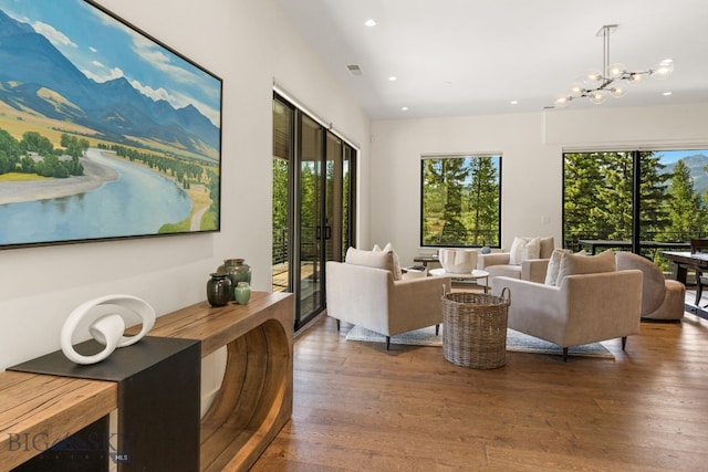 544 Grey Drake, Big Sky, MT 59716 - living area with plenty of natural light, recessed lighting, wood finished floors, and a chandelier