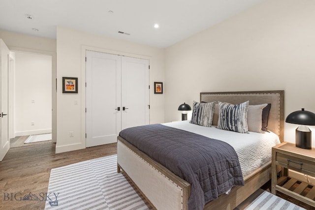 544 Grey Drake, Big Sky, MT 59716 - bedroom with wood finished floors, recessed lighting, and a closet