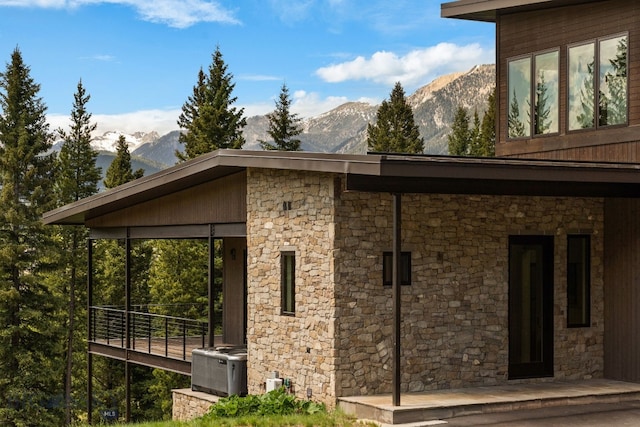 544 Grey Drake, Big Sky, MT 59716 - view of property exterior featuring stone siding and a mountain view