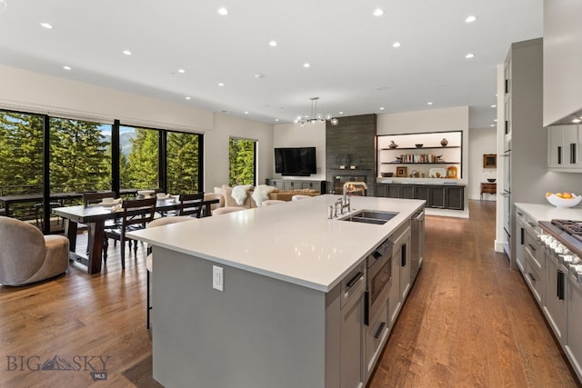 544 Grey Drake, Big Sky, MT 59716 - kitchen featuring gray cabinetry, a large island, recessed lighting, light countertops, and stainless steel appliances