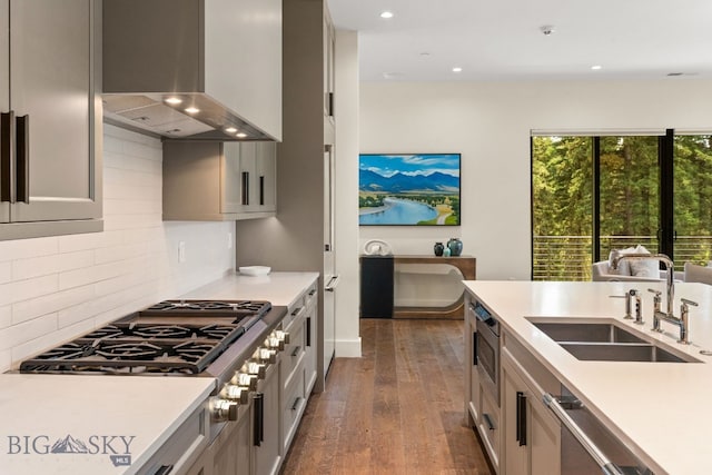 544 Grey Drake, Big Sky, MT 59716 - kitchen featuring island exhaust hood, stainless steel appliances, dark wood-style floors, light countertops, and recessed lighting
