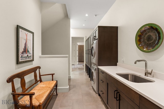 544 Grey Drake, Big Sky, MT 59716 - kitchen featuring stacked washer / dryer, dark brown cabinetry, light countertops, and recessed lighting