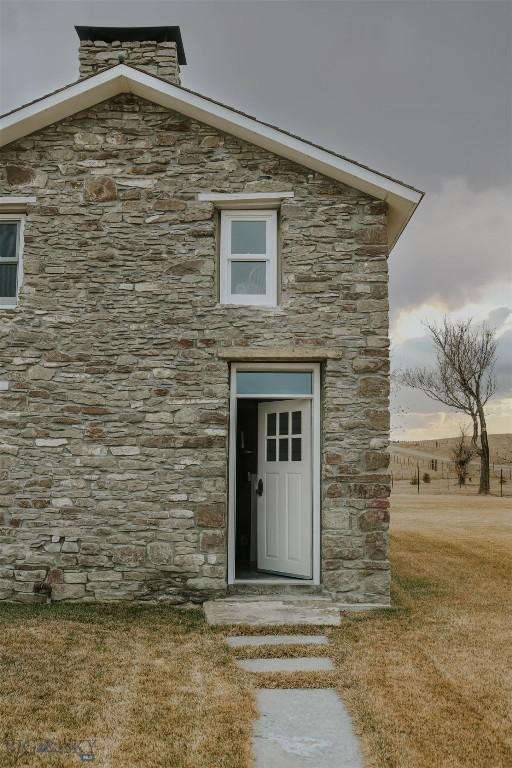 802 Deadmans Canyon Rd, Reed Point, MT 59069 - doorway to property featuring stone siding