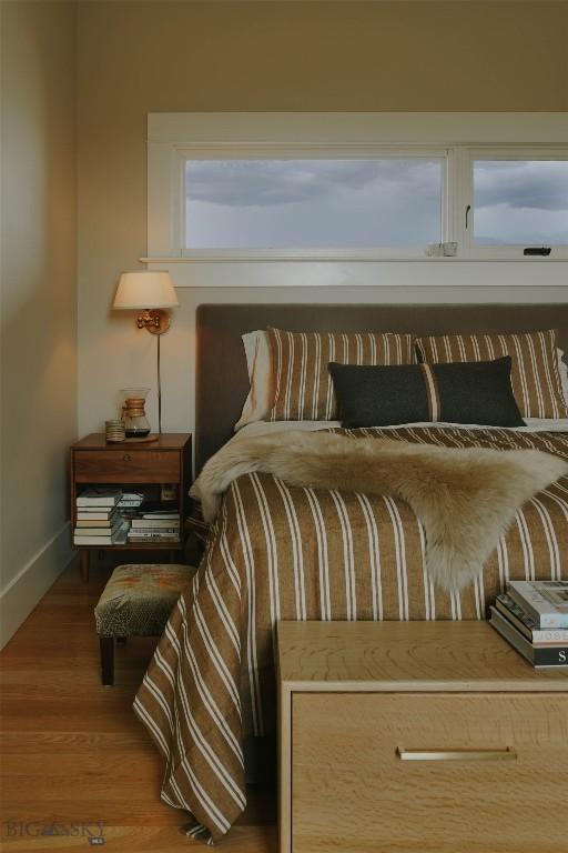 802 Deadmans Canyon Rd, Reed Point, MT 59069 - bedroom with baseboards and wood finished floors