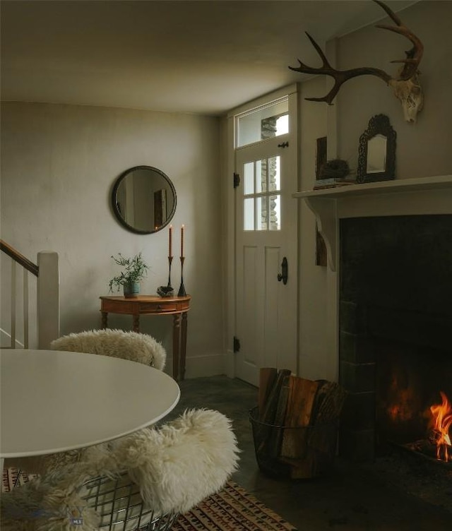 802 Deadmans Canyon Rd, Reed Point, MT 59069 - entrance foyer with a lit fireplace, wood finished floors, and stairway