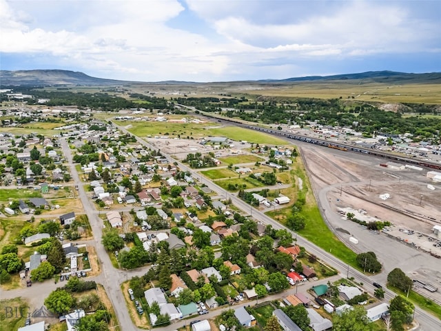 523 N I St, Livingston, MT 59047 - aerial view of property and surrounding area featuring a mountainous background and nearby suburban area