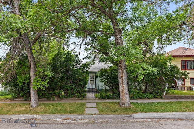 523 N I St, Livingston, MT 59047 - view of property hidden behind natural elements with a fenced front yard