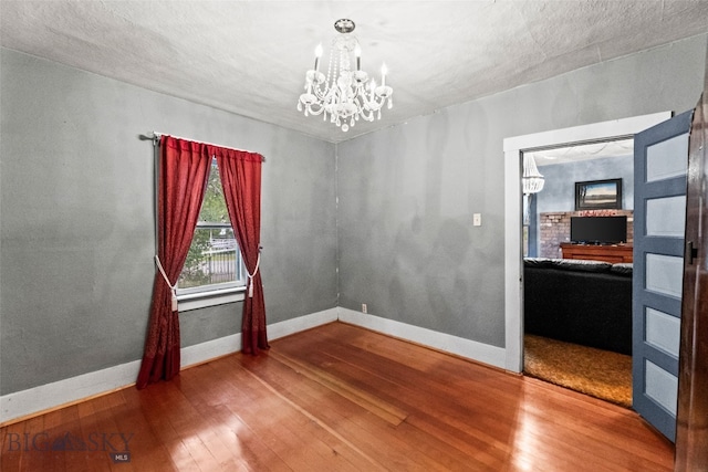 523 N I St, Livingston, MT 59047 - spare room featuring a chandelier and wood finished floors