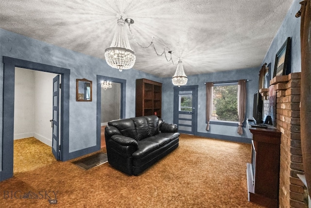 523 N I St, Livingston, MT 59047 - carpeted living area featuring a chandelier and a brick fireplace