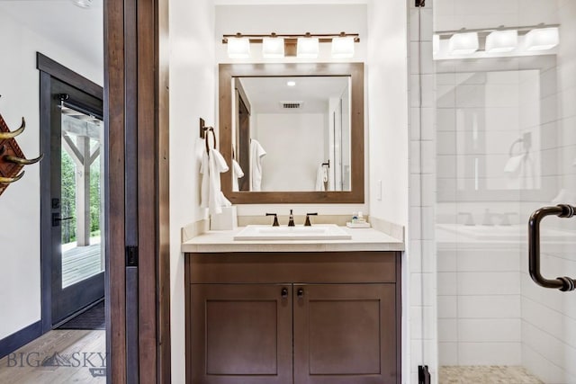 146 Outlook Trl, Big Sky, MT 59716 - full bath featuring a stall shower, vanity, and wood finished floors