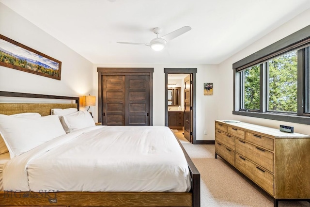 146 Outlook Trl, Big Sky, MT 59716 - bedroom featuring light carpet, connected bathroom, and ceiling fan