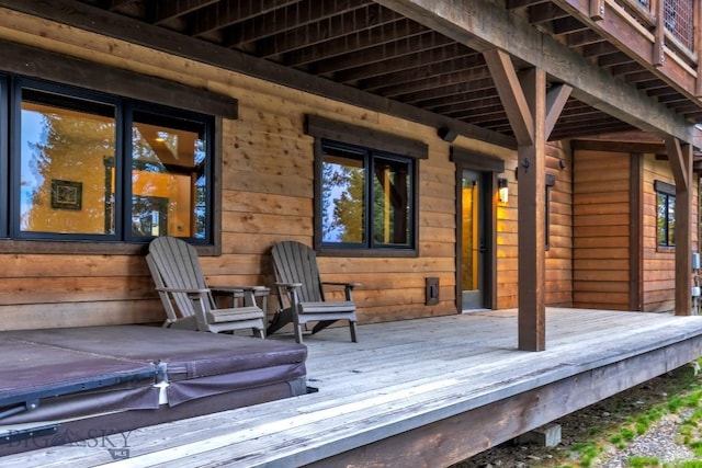 146 Outlook Trl, Big Sky, MT 59716 - wooden deck with a covered hot tub
