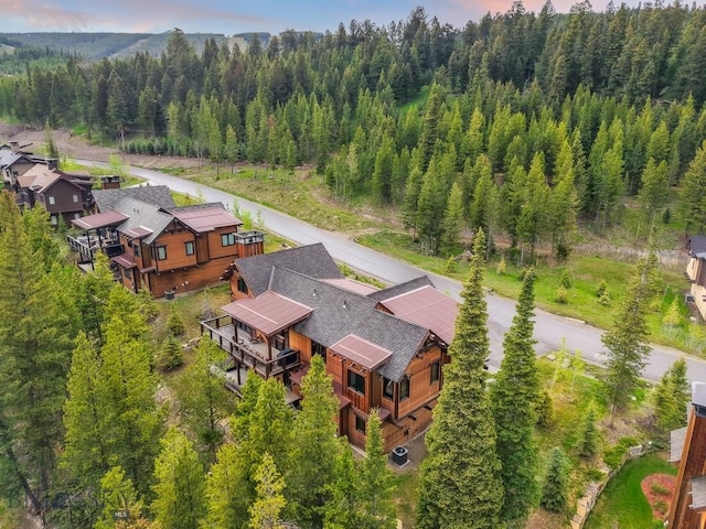 146 Outlook Trl, Big Sky, MT 59716 - view of subject property with a heavily wooded area