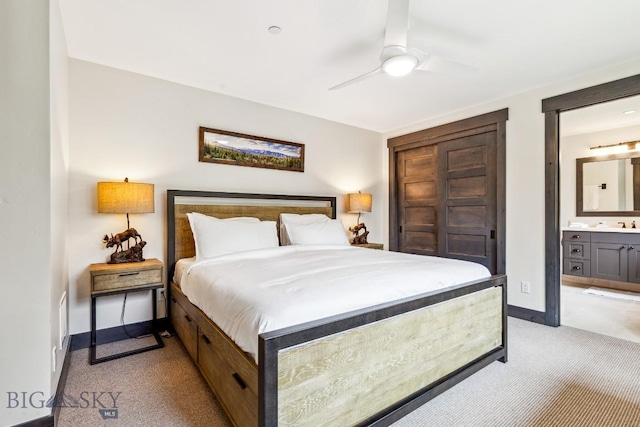 146 Outlook Trl, Big Sky, MT 59716 - bedroom with light colored carpet, connected bathroom, and ceiling fan