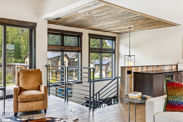 146 Outlook Trl, Big Sky, MT 59716 - living area featuring an upstairs landing, wooden ceiling, and hardwood / wood-style flooring