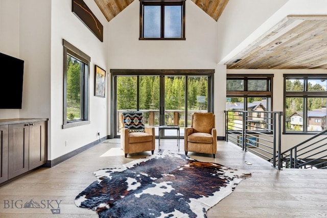 146 Outlook Trl, Big Sky, MT 59716 - living area with wooden ceiling, hardwood / wood-style floors, an upstairs landing, and high vaulted ceiling