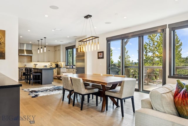 146 Outlook Trl, Big Sky, MT 59716 - dining space featuring light wood-style flooring, recessed lighting, and a chandelier