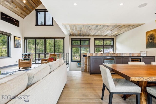 146 Outlook Trl, Big Sky, MT 59716 - dining space with beverage cooler, wood ceiling, light wood finished floors, recessed lighting, and high vaulted ceiling
