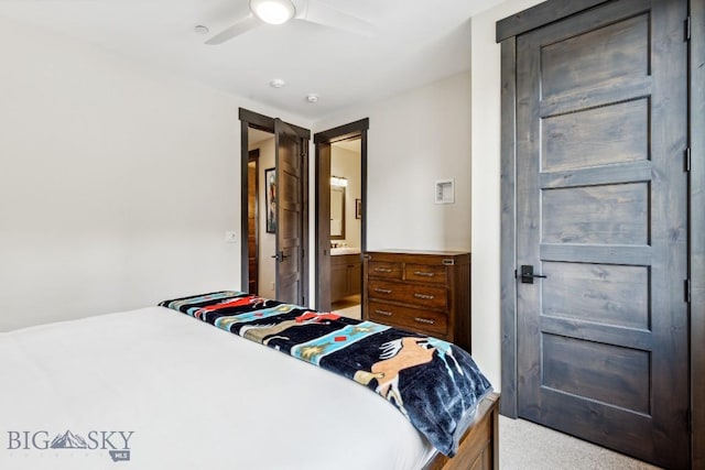 146 Outlook Trl, Big Sky, MT 59716 - bedroom with light carpet, ensuite bath, and a ceiling fan