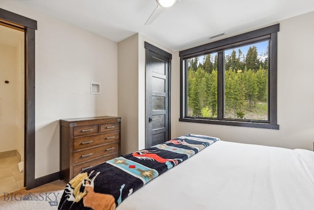 146 Outlook Trl, Big Sky, MT 59716 - carpeted bedroom with ceiling fan and baseboards