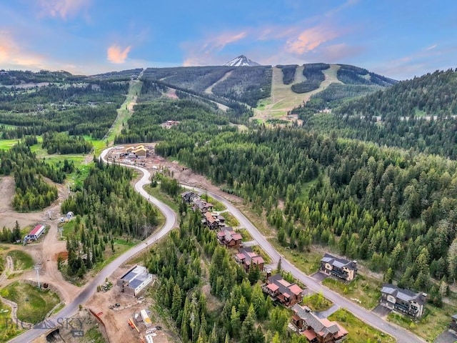 146 Outlook Trl, Big Sky, MT 59716 - aerial view of property and surrounding area featuring a mountainous background and a forest