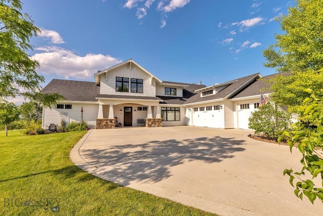 33 Oasis Trl, Bozeman, MT 59718 - craftsman-style house with concrete driveway, a front lawn, stone siding, and a garage