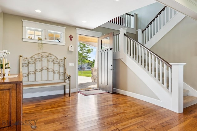33 Oasis Trl, Bozeman, MT 59718 - foyer entrance with hardwood / wood-style floors, stairs, and recessed lighting