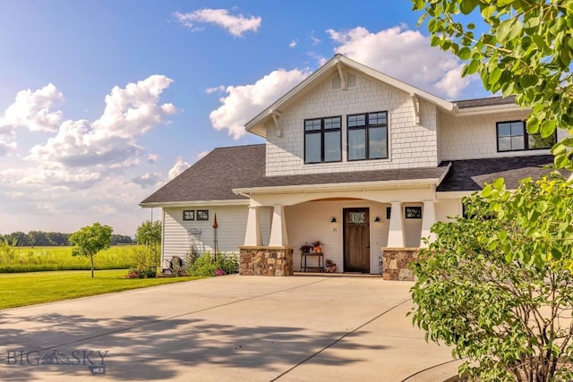 33 Oasis Trl, Bozeman, MT 59718 - craftsman house with covered porch, driveway, and stone siding