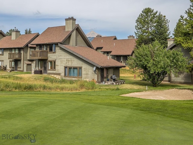20 Yellowstone Spur Rd Unit 20A, Big Sky, MT 59716 - view of home's community featuring a yard
