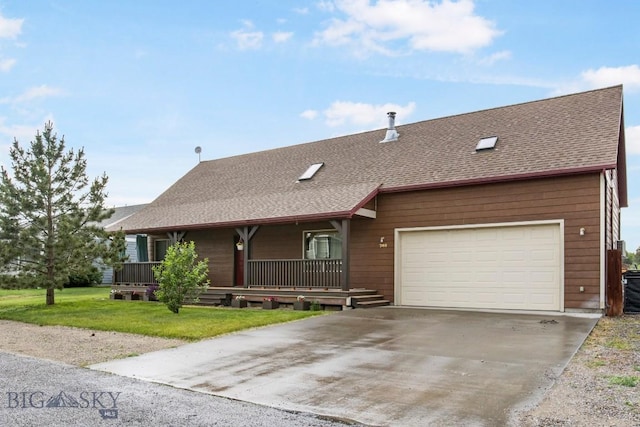 740 Linda Ln, Three Forks, MT 59752 - view of front of home featuring a porch, a shingled roof, concrete driveway, a front yard, and a garage