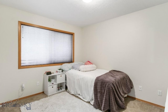 740 Linda Ln, Three Forks, MT 59752 - bedroom with baseboards and light carpet