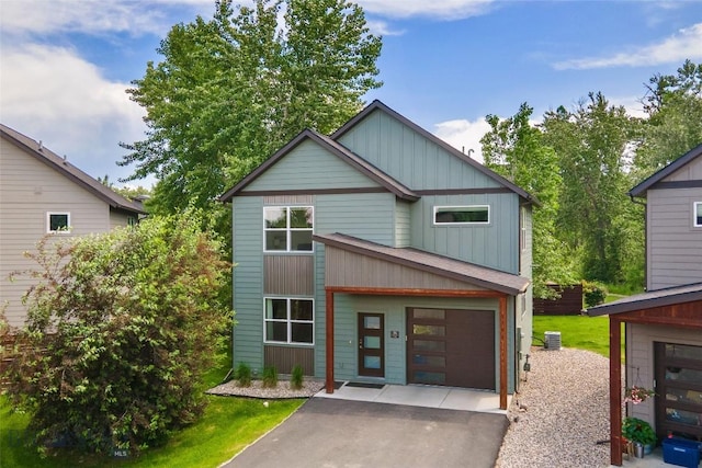 26 Locomotive Loop, Bozeman, MT 59718 - view of front of property featuring driveway and board and batten siding