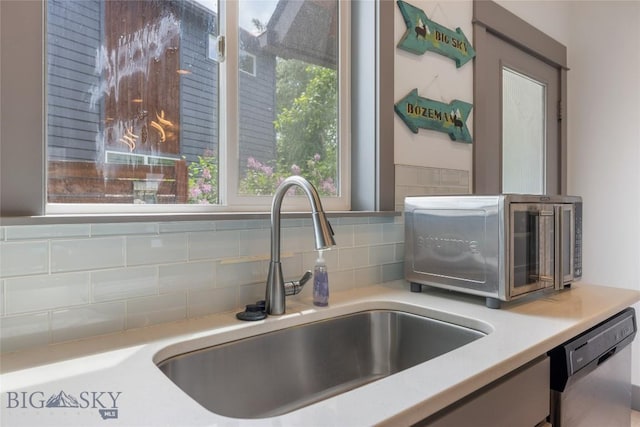 26 Locomotive Loop, Bozeman, MT 59718 - kitchen view of stainless steel dishwasher, backsplash, and light countertops