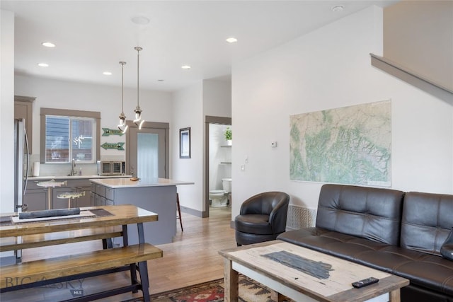 26 Locomotive Loop, Bozeman, MT 59718 - living room featuring light wood-style floors and recessed lighting