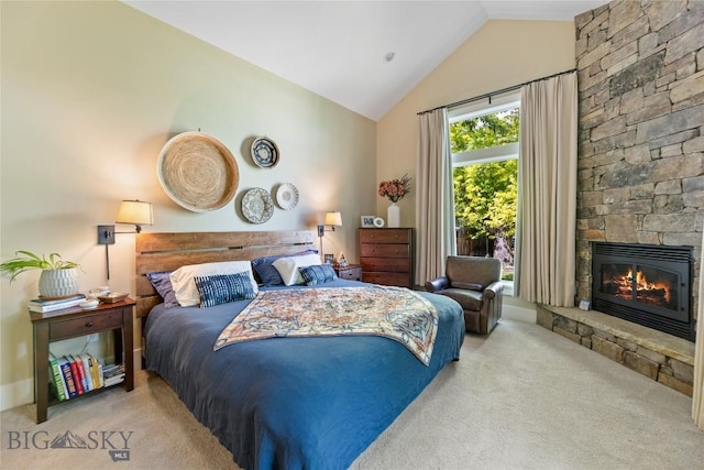 425 S Yellowstone St, Livingston, MT 59047 - carpeted bedroom featuring a stone fireplace and high vaulted ceiling