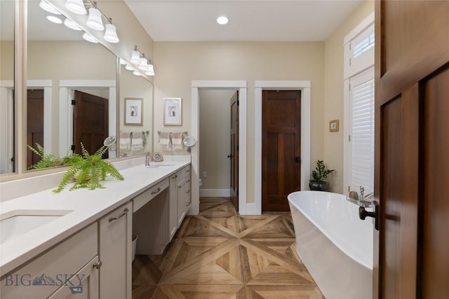 425 S Yellowstone St, Livingston, MT 59047 - full bath with double vanity, a freestanding bath, and recessed lighting
