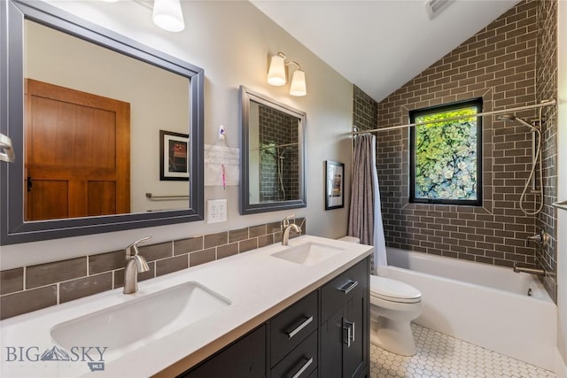425 S Yellowstone St, Livingston, MT 59047 - full bath featuring vaulted ceiling, double vanity, tile patterned floors, and shower / tub combo with curtain