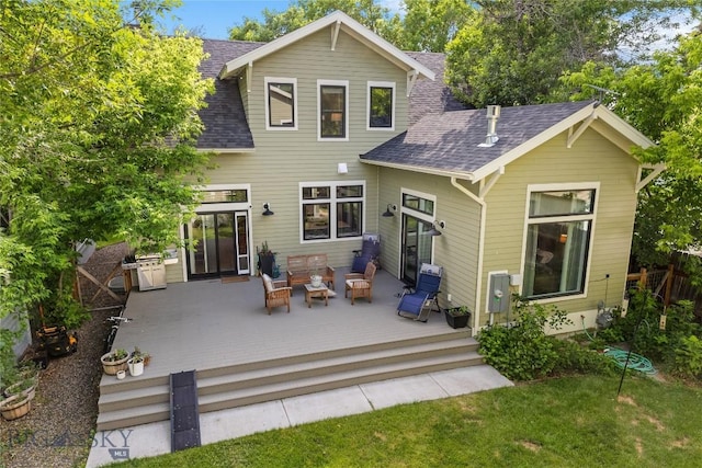 425 S Yellowstone St, Livingston, MT 59047 - back of house featuring roof with shingles, a deck, outdoor lounge area, and a yard