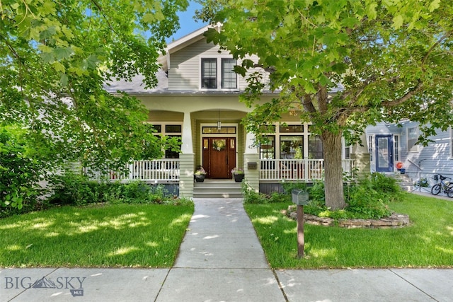 425 S Yellowstone St, Livingston, MT 59047 - view of front facade featuring covered porch and a front lawn