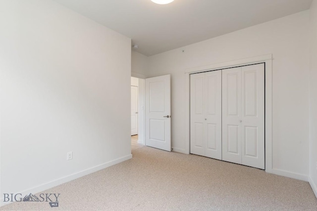 2221F Willow Unit 104, Livingston, MT 59047 - unfurnished bedroom featuring light carpet and a closet