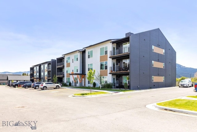 2221F Willow Unit 104, Livingston, MT 59047 - view of building exterior featuring uncovered parking and a mountain view