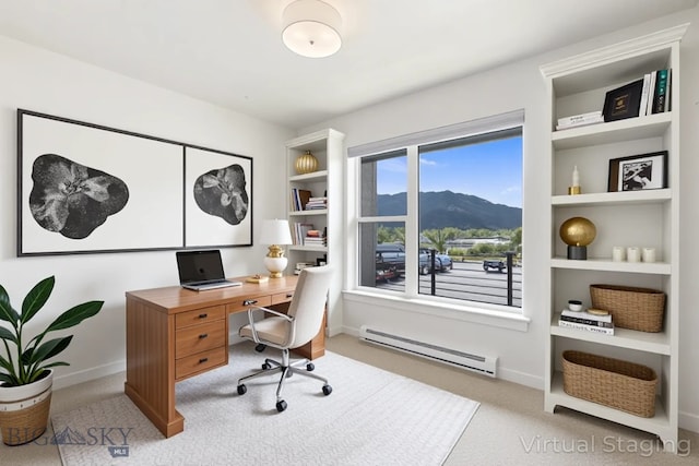 2221F Willow Unit 104, Livingston, MT 59047 - carpeted home office featuring baseboard heating, a mountain view, and built in features