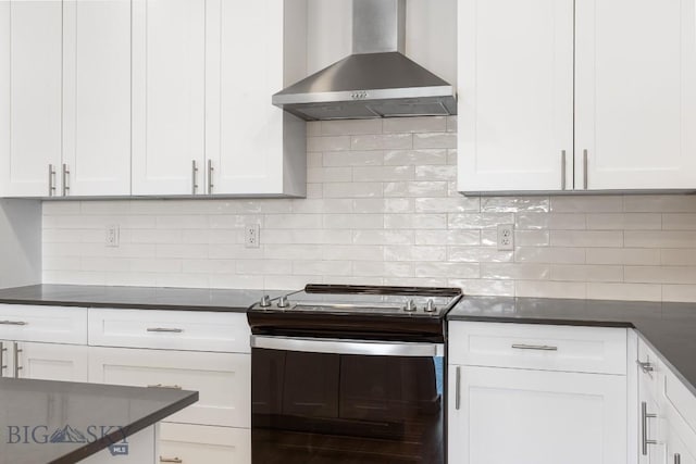 2221F Willow Unit 104, Livingston, MT 59047 - kitchen featuring wall chimney exhaust hood, stainless steel gas range oven, and dark countertops