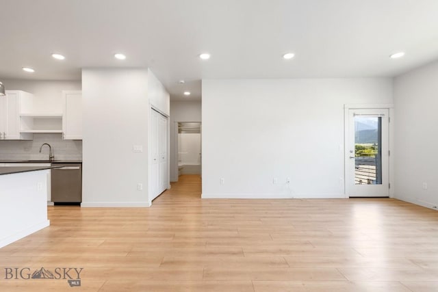 2221F Willow Unit 104, Livingston, MT 59047 - unfurnished living room with light wood finished floors and recessed lighting