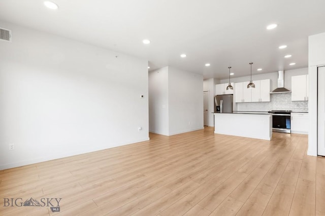 2221F Willow Unit 104, Livingston, MT 59047 - unfurnished living room featuring light wood-style floors and recessed lighting