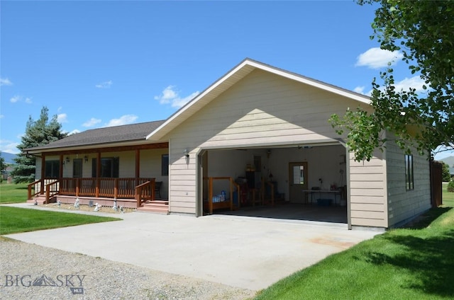 5 Ginger Quill Ct, Mcallister, MT 59740 - view of front of home with covered porch, a garage, driveway, and a front yard