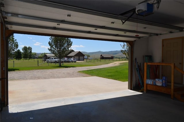 5 Ginger Quill Ct, Mcallister, MT 59740 - garage featuring a mountain view and a garage door opener